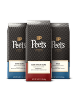 Three Peet's coffee bags with different blends on a black background