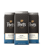 Three Peet's coffee bags with different blends on a black background